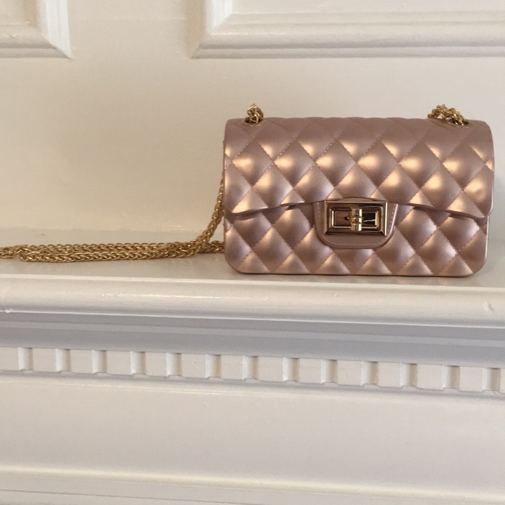 Rose gold clutch with a gold chain